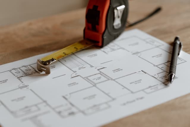 Measuring tape on a blueprint of a new home
