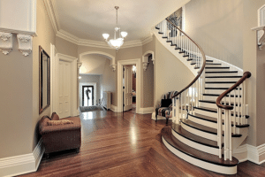 A grand staircase is featured in one of the many realizations of a dream home build by Babb Custom