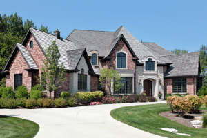 A serene driveway leads to a custom home built from retirement house plans by Babb Custom Homes